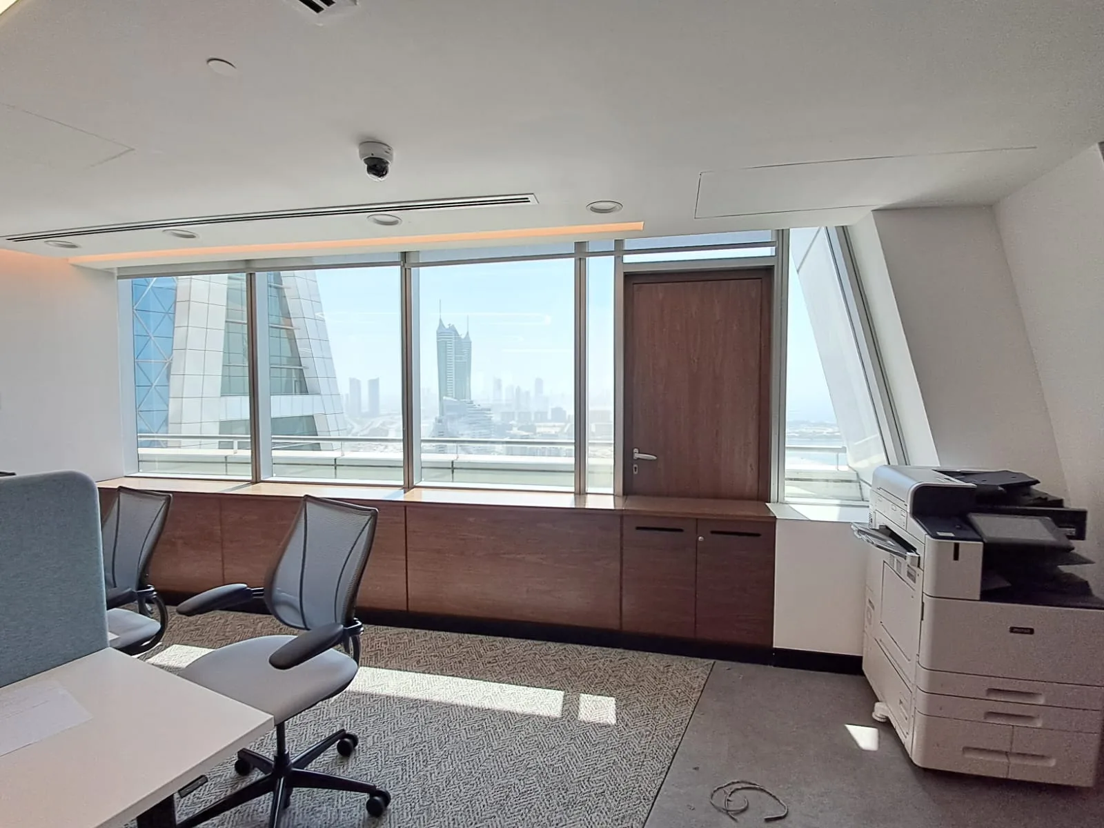 Completed corporate office fit-out with bespoke joinery, Oliver Wyman Bahrain